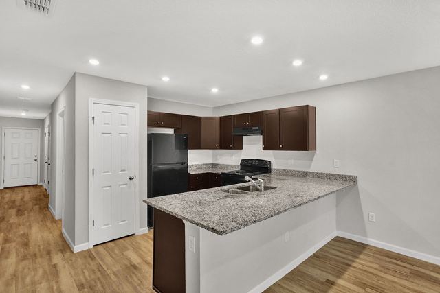 Kitchen with granite breakfast bar
